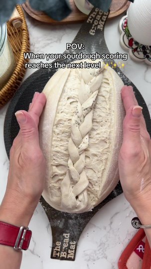 TikTok post by @natalia.s.baking: Making a braid on a sourdough loaf. Scoring and decorating the loaf is my favorite part…