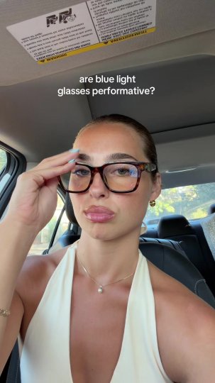 TikTok post by @heather.eva: The creator, sitting in a car, poses a question to her audience about whether wearing…