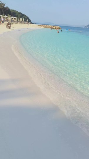 TikTok post by @adnan_bhf: This video features a calm, scenic view of the beach at Arameras Beach Resort in Ksamil,…
